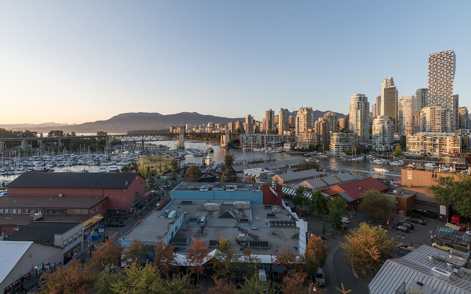 Sunset over False Creek with Granville Island, the Burrard Street Bridge and the downtown skyline